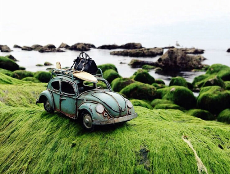 Vintage Volkswagen toy car on the shore, photo by Kim Leuenberger