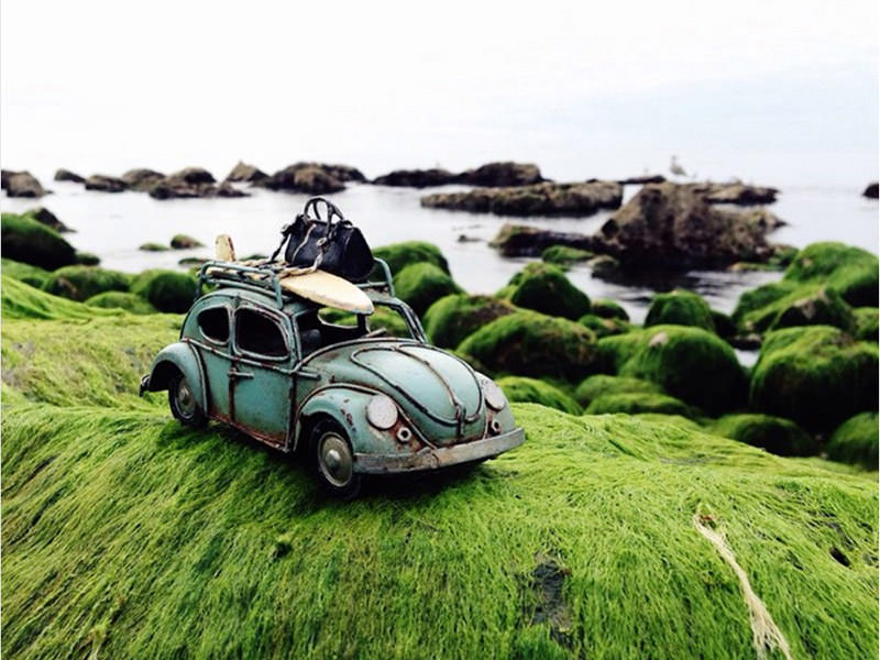 Vintage Volkswagen toy car on the shore, photo by Kim Leuenberger