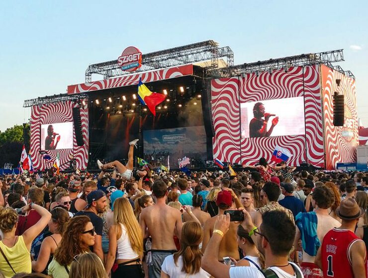 A girl crowd surfing on the hands of the audience at the concert of Rudimental at Sziget Festival 2017 in Budapest, Hungary, photo by Ivan Kralj