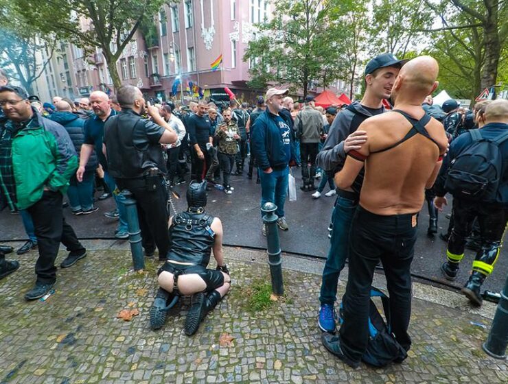 Leather cigar man with a human puppy on a leash at Folsom Europe Street Fair, the biggest European gay fetish event, in Berlin, Germany, photo by Ivan Kralj