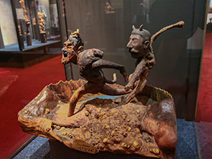 Hitler and Stalin portrayed like devils running over the piles of human skulls - the sculpture called "My Lithuania" was created by the artist Kazys Dereškevičius and is displayed at Devil's Museum in Kaunas, Lithuania, photo by Ivan Kralj