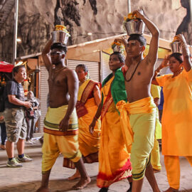 Photograph of pilgrims carrying Paal Kudam, brass pots filled with milk, as offerings for Thaipusam festival, photo by Ivan Kralj