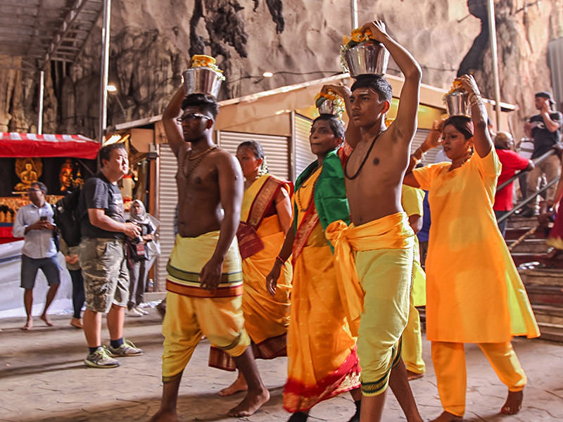 Photograph of pilgrims carrying Paal Kudam, brass pots filled with milk, as offerings for Thaipusam festival, photo by Ivan Kralj