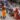 Photograph of a boy at the stairs of Batu Caves, providing space for his father's climb - his father is carrying Paal Kudam, brass pot filled with milk, on his head, while moving on his knees at Thaipusam festival, photo by Ivan Kralj