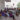 Photograph of Thaipusam pilgrims resting in the shade at the river bank at Thaipusam festival