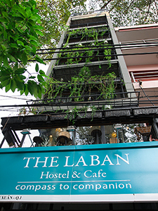 The facade of hotel Laban in Saigon, covered by the greenery