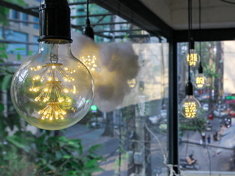 Photo of the lightbulbs in the mezzanine of The Laban hotel, one of them "dressed" in a cotton wool resembling a cloud, photo by Ivan Kralj