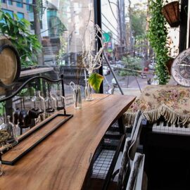 The photo of rustical details in The Laban hotel mezzanine, bottles, clock, wood, plants, keyboard, photo by Ivan Kralj