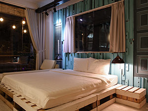 Simply decorated double room in hotel The Laban in Ho Chi Minh City Vietnam. Blue wood on the walls and spacious windows, photo by Ivan Kralj