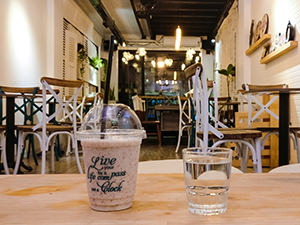 Rice-Field smoothie made of blended yogurt, brown rice and fermented rice, at The Laban hotel bar, in a cup with the printed words "Live your life by a compass, not a clock", photo by Ivan Kralj
