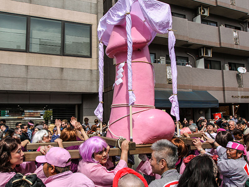 Pink penis-shaped mikoshi, portable shrine, being carried by crossdressers at Kanamara Matsuru, festival of the iron penis, in Kawasaki, Japan, photo by Ivan Kralj