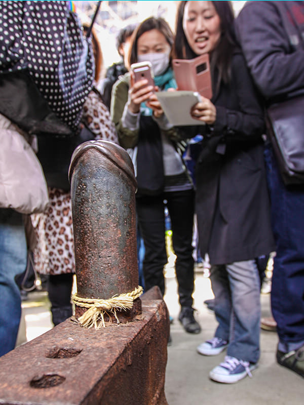 Penis-shaped anvil being photographed by the visitors at Kanayama Shrine in Kawasaki, Japan, during the Kanamara Matsuru, festival of the iron penis, photo by Ivan Kralj