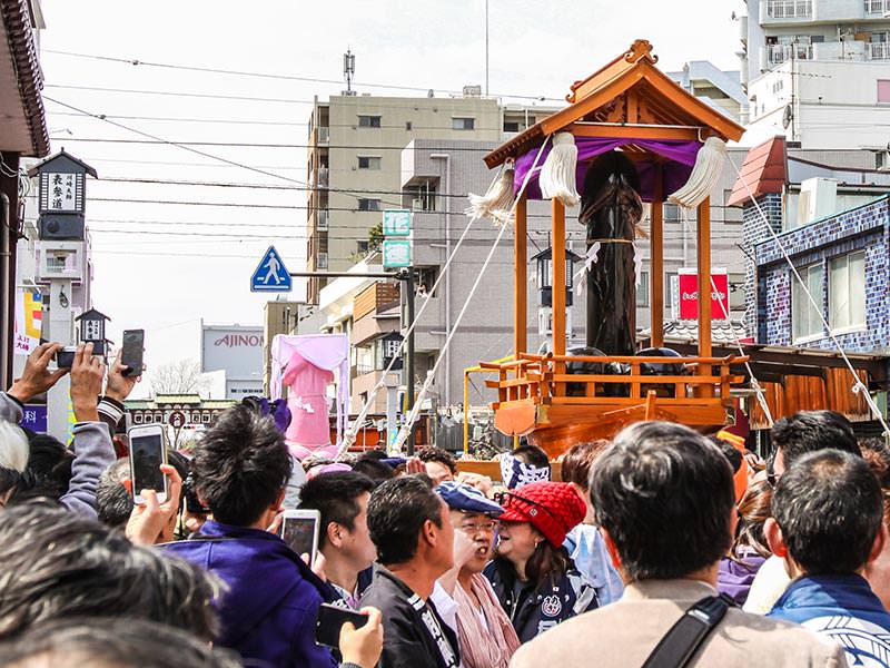 Penis-shaped mikoshis, portable shrines, being carried in the streets during the penis parade at Kanamara Matsuru, festival of the iron penis, in Kawasaki, Japan, photo by Ivan Kralj