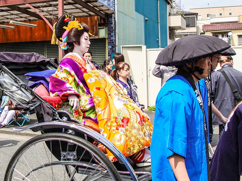 Lavishly decorated lady in the carriage at Kanamara Matsuru, festival of the iron penis, in Kawasaki, Japan, photo by Ivan Kralj