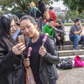 People licking penis and vagina shaped lollipops at Kanamara Matsuru, festival of the iron penis, in Kawasaki, Japan, photo by Ivan Kralj