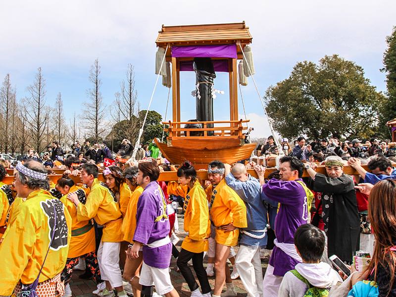 Group of worshippers carrying the mikoshi, portable shrine at Kanamara Matsuru, festival of the iron penis, in Kawasaki, Japan, photo by Ivan Kralj