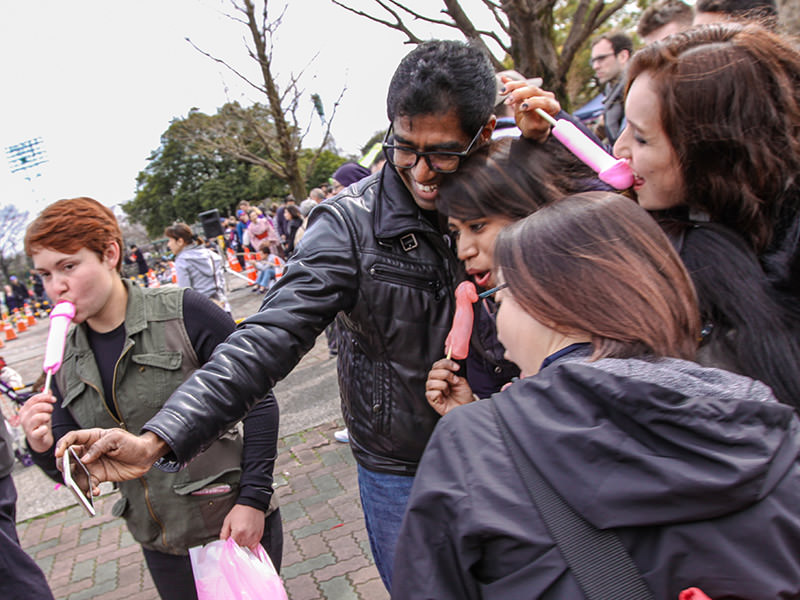 Group of friends posing with penis shaped lollipops at Kanamara Matsuru, festival of the iron penis, in Kawasaki, Japan, photo by Ivan Kralj