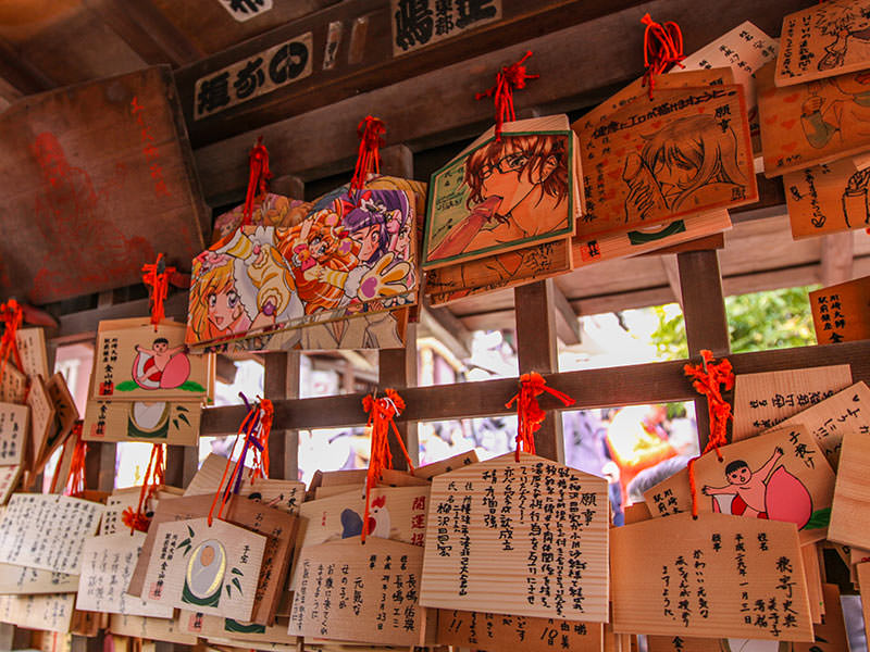 Wooden plaques called ema, containing prayers of the worshippers and some seriously explicit manga images of oral sex, photo by Ivan Kralj