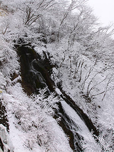 Different kind of spring in Japan: Kegon Falls' water making its way through the snowy surrounding, birds eye perspective, Japan, photo by Ivan Kralj