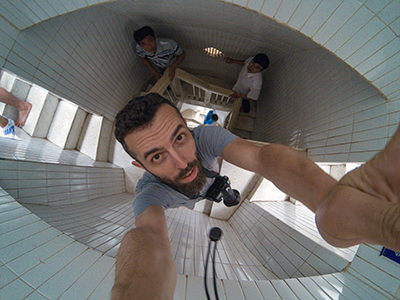 Pipeaway blogger Ivan Kralj holding the camera inside of the Asian Jesus statue in Vung Tau, Vietnam, photographing 133-step staircase from above, photo by Ivan Kralj
