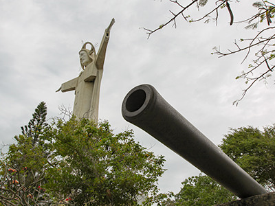 Cannon near the Vietnamese Jesus statue (in second plan), in Vung Tau, Vietnam, photo by Ivan Kralj