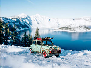 Vintage toy car in the snowy mountain, photo by Kim Leuenberger