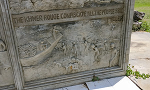 Bas-relief at Well of Shadows memorial in Battambang, Cambodia, showing the Khmer Rouge confiscating people's bicycles, photo by Ivan Kralj