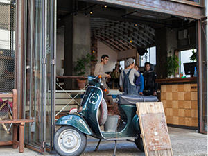 Vespa moped at the entrance of Nui. hostel and bar lounge, in Tokyo, Japan, photo copyright by Nui.