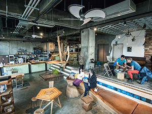 People sitting in the bar lounge at Nui hostel in Tokyo, Japan, photo copyright by Nui.