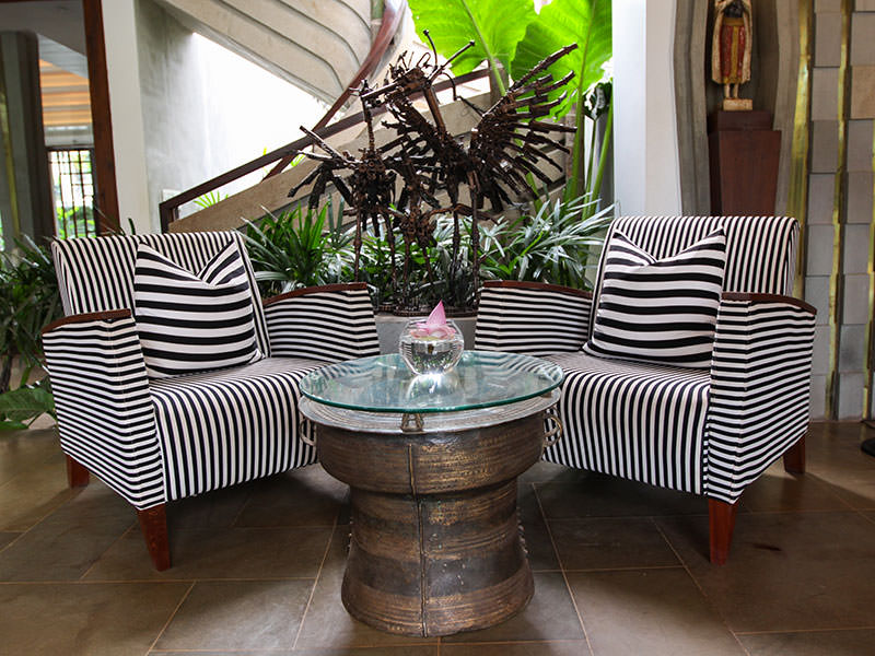 Chairs and rain drum turned table at Jaya House River Park hotel lobby, in Siem Reap, Cambodia, photo by Ivan Kralj