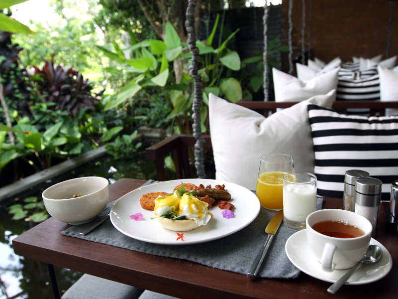 Eggs Florentine served for breakfast on the swinging chair at the restaurant of Jaya House River Park hotel, in Siem Reap, Cambodia, photo by Ivan Kralj