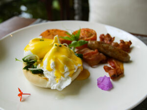 Eggs Florentine served for breakfast on the swinging chair at the restaurant of Jaya House River Park hotel, in Siem Reap, Cambodia, photo by Ivan Kralj