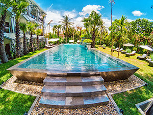 Silver-tiled swimming pool in the garden of Jaya House RiverPark hotel in Siem Reap, Cambodia, photo by Ivan Kralj