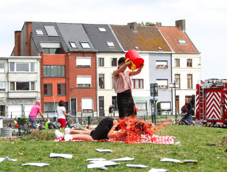 Female performers in Cie Woest's show "Lucky Shots" spilling several liters of tomato puree over fellow performers, at Miramiro street theatre festival in Ghent, Belgium, photo by Ivan Kralj