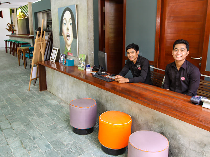 Smiling staff at Rambutan Resort Phnom Penh reception, Cambodia, photo by Ivan Kralj