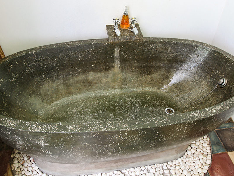 Stone bathtub at the balcony in Rambutan Resort Siem Reap, Cambodia, photo by Ivan Kralj