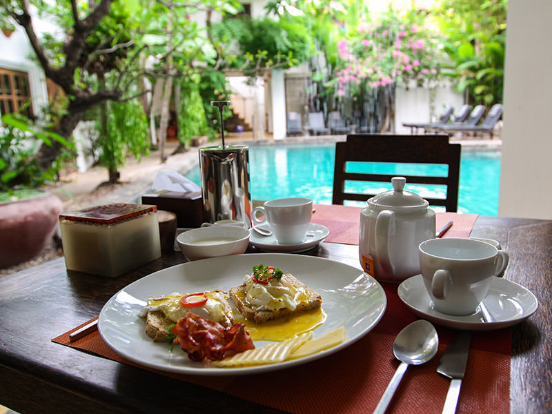 Poached eggs and bacon breakfast at Rambutan Resort Siem Reap, Cambodia, photo by Ivan Kralj