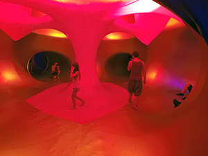 Red interior of Luminarium art installation, inflatable labyrinth of tunnels and domes at Sziget Festival 2017 in Budapest, Hungary, photo by Ivan Kralj