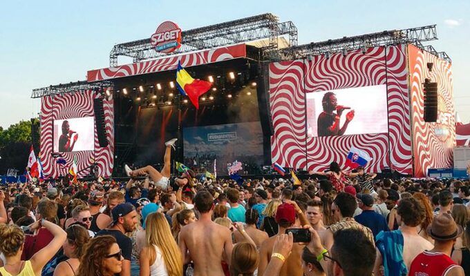 A girl crowd surfing on the hands of the audience at the concert of Rudimental at Sziget Festival 2017 in Budapest, Hungary, photo by Ivan Kralj