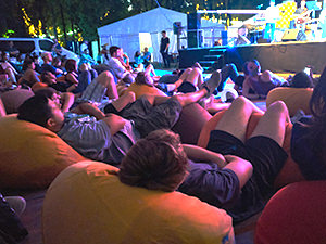 Audience members laying on several bean bags with legs in the air, at the classical concert at Sziget Festival 2017 in Budapest, Hungary, photo by Ivan Kralj