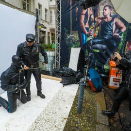Leather man with a mask-covered slave on a leash at Folsom Europe Street Fair, the biggest European gay fetish event, in Berlin, Germany, photo by Ivan Kralj
