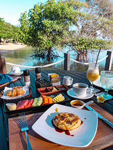 Pineapple pancake with palm sugar syrup, served for breakfast on the beach with mangrove trees, at The Menjangan, one of the answers to where to stay in Bali, Indonesia, photo by Ivan Kralj