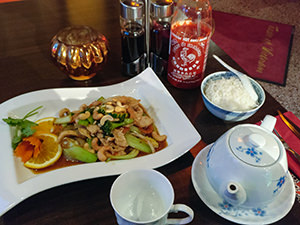 Wok dish with chicken, cashew nuts and rice, with jasmine tea, at Taste of Vietnam restaurant in Stockholm, Sweden, photo by Ivan Kralj