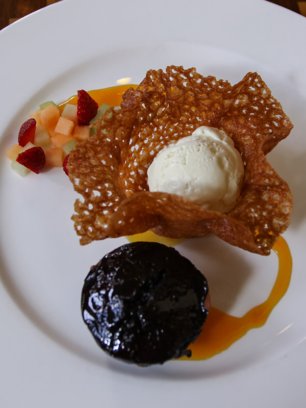 Chocolate lava cake served with ice-cream and marinated fruit, at Kemangi Bistro restaurant in Hyatt Regency Yogyakarta hotel in Jogjakarta, Indonesia, photo by Ivan Kralj