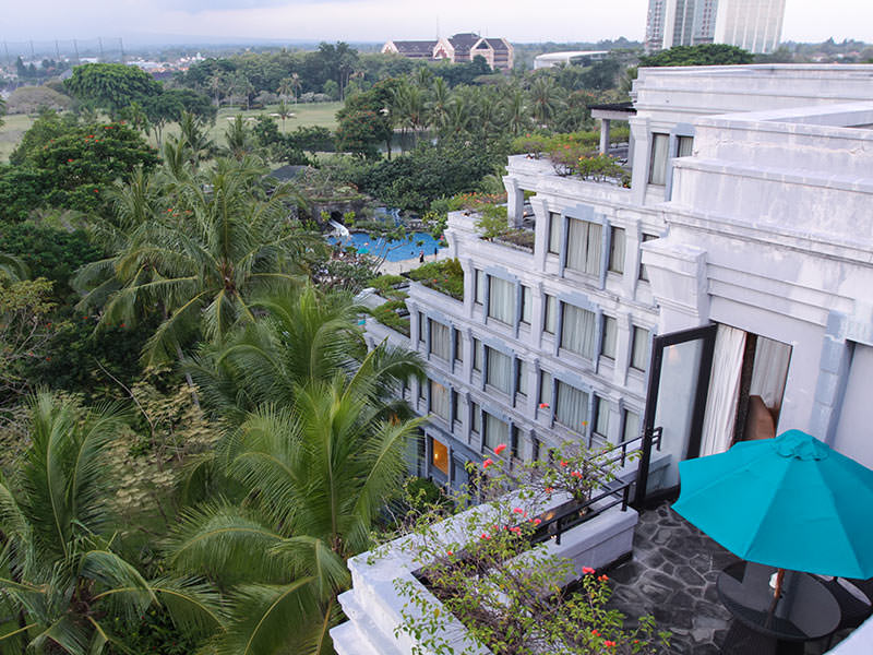 Views from the roof of the Hyatt Regency Yogyakarta hotel with lush tropical garden and swimming pools, in Jogjakarta, Indonesia, photo by Ivan Kralj