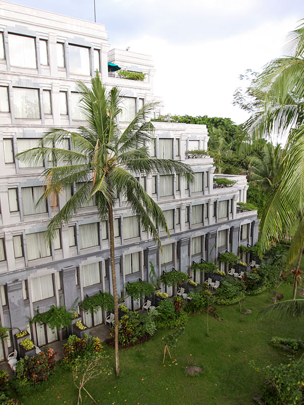 Exterior of Hyatt Regency Yogyakarta hotel, giant palms in front of the building, in Jogjakarta, Indonesia, photo by Ivan Kralj