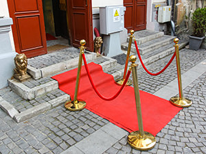 Little red carpet and golden lions at the entrance to the Romanian Kitsch Museum in Bucharest, Romania, photo by Ivan Kralj.