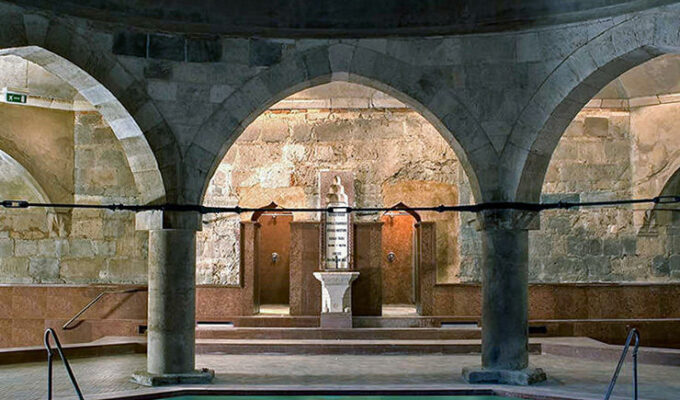 16th century Rudas Baths main pool surrounded by pillars holding the dome, in Budapest, Hungary, photo by Ivan Kralj