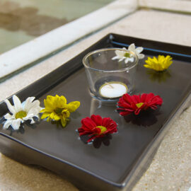 The decorative flowers floating in the plate with water and candle in the bathroom of the private pavilion at the Balé resort in Nusa Dua, Bali, Indonesia, photo by Ivan Kralj