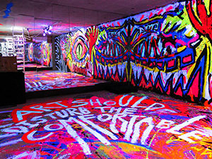 Colorful basement in ART'n'SHELTER hostel in Tokyo, Japan, covered with psychedelic illuminating graffitis by the artist called Zon, photo by Ivan Kralj